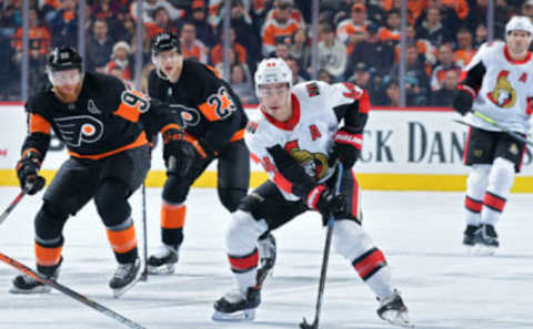 PHILADELPHIA, PA – DECEMBER 07: Jean-Gabriel Pageau #44 of the Ottawa Senators skates into the offensive zone ahead of Jakub Voracek #93 and Oskar Lindblom #23 of the Philadelphia Flyers in the first period at Wells Fargo Center on December 7, 2019 in Philadelphia, Pennsylvania. (Photo by Drew Hallowell/Getty Images)