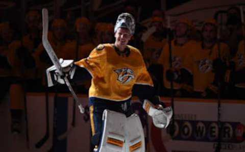 May 10, 2021; Nashville, Tennessee, USA; Nashville Predators goaltender Pekka Rinne (35) celebrates with teammates after a shutout win in what could be his final home game as a starter against the Carolina Hurricanes at Bridgestone Arena. Mandatory Credit: Christopher Hanewinckel-USA TODAY Sports