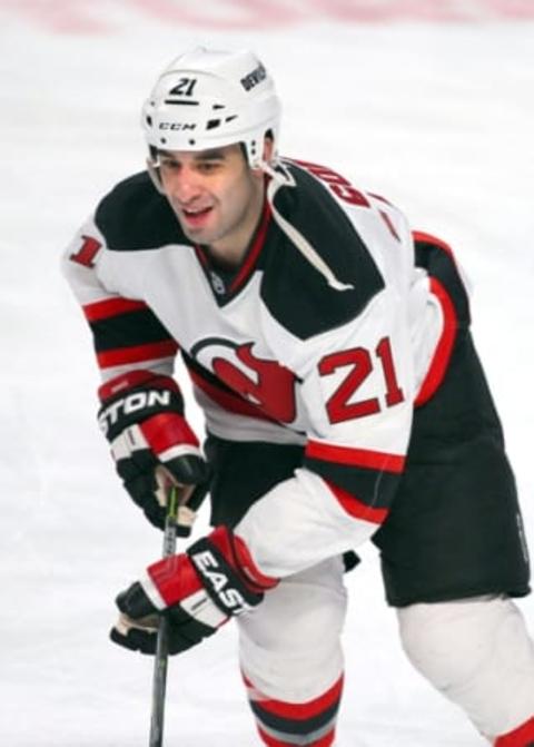 Feb 7, 2015; Montreal, Quebec, CAN; New Jersey Devils center Scott Gomez (21) before the game against Montreal Canadiens at Bell Centre. Mandatory Credit: Jean-Yves Ahern-USA TODAY Sports