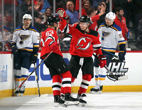 NEWARK, NEW JERSEY – MARCH 06: Jesper Bratt #63 of the New Jersey Devils (L) celebrates his goal against the St. Louis Blues at 8:38 of the first period and is joined by Nikita Gusev #97 (R) at the Prudential Center on March 06, 2020 in Newark, New Jersey. (Photo by Bruce Bennett/Getty Images)