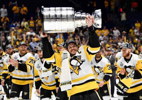 Jun 11, 2017; Nashville, TN, USA; Pittsburgh Penguins center Sidney Crosby (87) hoists the Stanley Cup after defeating the Nashville Predators in game six of the 2017 Stanley Cup Final at Bridgestone Arena. Mandatory Credit: Christopher Hanewinckel-USA TODAY Sports