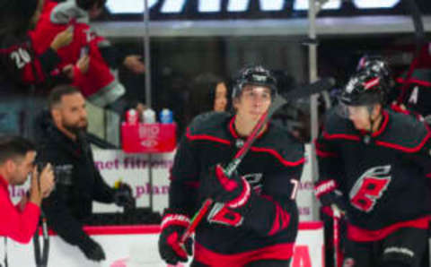 Oct 27, 2023; Raleigh, North Carolina, USA; Carolina Hurricanes defenseman Brady Skjei (76) watches the puck in the air before the game against the San Jose Sharks at PNC Arena. Mandatory Credit: James Guillory-USA TODAY Sports