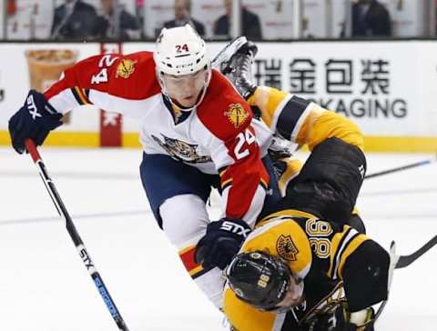 Mar 24, 2016; Boston, MA, USA; Boston Bruins defenseman Kevan Miller (86) is spilled by Florida Panthers left wing Jiri Hudler (24) during the second period at TD Garden. Mandatory Credit: Winslow Townson-USA TODAY Sports