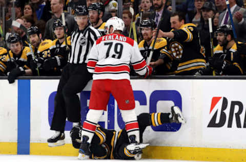 BOSTON, MASSACHUSETTS – MAY 12: Micheal Ferland #79 of the Carolina Hurricanes checks Matt Grzelcyk #48 of the Boston Bruins during the first period in Game Two of the Eastern Conference Final during the 2019 NHL Stanley Cup Playoffs at TD Garden on May 12, 2019 in Boston, Massachusetts. (Photo by Bruce Bennett/Getty Images)