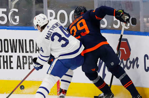 Toronto Maple Leafs forward Auston Matthews (34) and Edmonton Oilers forward Leon Draisaitl (29) battle Mandatory Credit: Perry Nelson-USA TODAY Sports