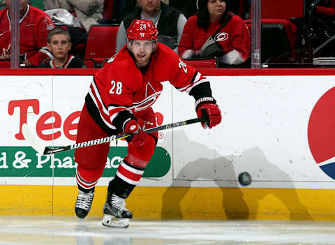 RALEIGH, NC – JANUARY 14: Elias Lindholm #28 of the Carolina Hurricanes shoots the puck during an NHL game against the Calgary Flames on January 14, 2018 at PNC Arena in Raleigh, North Carolina. (Photo by Gregg Forwerck/NHLI via Getty Images)