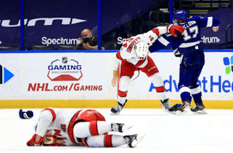 TAMPA, FLORIDA – APRIL 19: Alex Killorn #17 of the Tampa Bay Lightning and Jake Gardiner #51 of the Carolina Hurricanes fight during a game at Amalie Arena on April 19, 2021, in Tampa, Florida. (Photo by Mike Ehrmann/Getty Images)