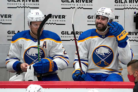 Jan 29, 2022; Glendale, Arizona, USA; Buffalo Sabres right wing Alex Tuch (89) celebrates with right wing Kyle Okposo (21) after scoring against the Arizona Coyotes in the second period at Gila River Arena. Mandatory Credit: Rick Scuteri-USA TODAY Sports