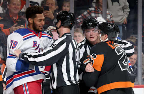 PHILADELPHIA, PENNSYLVANIA – NOVEMBER 24: K’Andre Miller #79 of the New York Rangers and Sean Walker #26 of the Philadelphia Flyers are separated during the second period at the Wells Fargo Center on November 24, 2023 in Philadelphia, Pennsylvania. (Photo by Tim Nwachukwu/Getty Images)