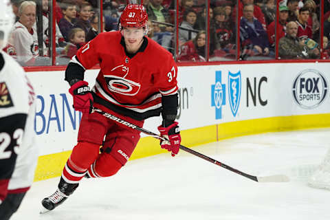 RALEIGH, NC – DECEMBER 16: Carolina Hurricanes Left Wing Andrei Svechnikov (37) chases a puck along the boards during a game between the Carolina Hurricanes and the Arizona Coyotes at the PNC Arena in Raleigh, NC on December 16, 2018. (Photo by Greg Thompson/Icon Sportswire via Getty Images)