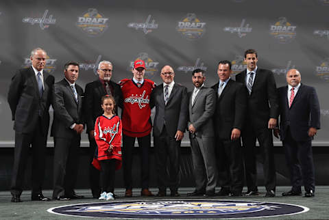 BUFFALO, NY – JUNE 24: Lucas Johansen poses with team personnel after being selected 28th overall by the Washington Capitals during round one of the 2016 NHL Draft at First Niagara Center on June 24, 2016 in Buffalo, New York. (Photo by Dave Sandford/NHLI via Getty Images)