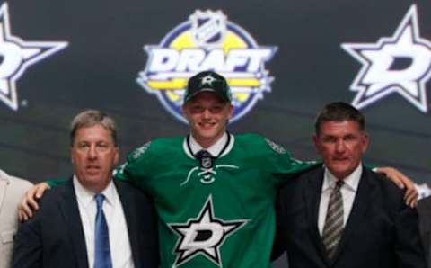 Jun 24, 2016; Buffalo, NY, USA; Riley Tufte poses for a photo after being selected as the number twenty-five overall draft pick by the Dallas Stars in the first round of the 2016 NHL Draft at the First Niagra Center. Mandatory Credit: Timothy T. Ludwig-USA TODAY Sports