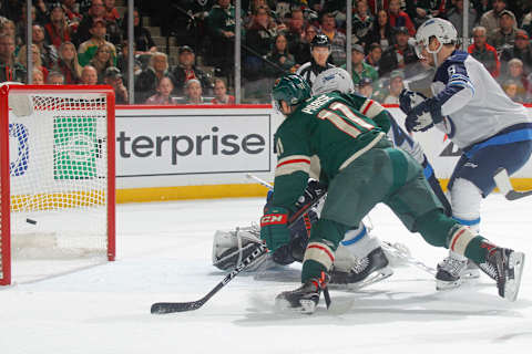 ST. PAUL, MN – APRIL 15: Zach Parise #11 of the Minnesota Wild scores a goal with Jacob Trouba #8 and Connor Hellebuyck #37 of the Winnipeg Jets defending in Game Three of the Western Conference First Round during the 2018 NHL Stanley Cup Playoffs at the Xcel Energy Center on April 15, 2018 in St. Paul, Minnesota. (Photo by Bruce Kluckhohn/NHLI via Getty Images)