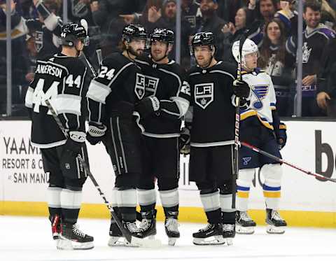 LOS ANGELES, CALIFORNIA – MARCH 04: Kevin Fiala, #22 of the Los Angeles Kings, celebrates his empty-net goal with Mikey Anderson #44, Phillip Danault #24, and Viktor Arvidsson #33 in front of Torey Krug #47 of the St. Louis Blues during a 4-2 Kings win at Crypto.com Arena on March 04, 2023, in Los Angeles, California. (Photo by Harry How/Getty Images)