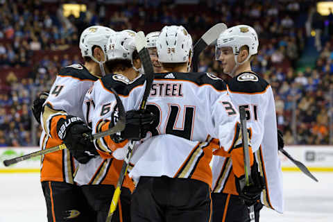 VANCOUVER, BC – MARCH 26: Anaheim Ducks Right-Wing Kiefer Sherwood (64) is congratulated after scoring a goal against the Vancouver Canucks during their NHL game at Rogers Arena on March 26, 2019, in Vancouver, British Columbia, Canada. Anaheim won 5-4. (Photo by Derek Cain/Icon Sportswire via Getty Images)