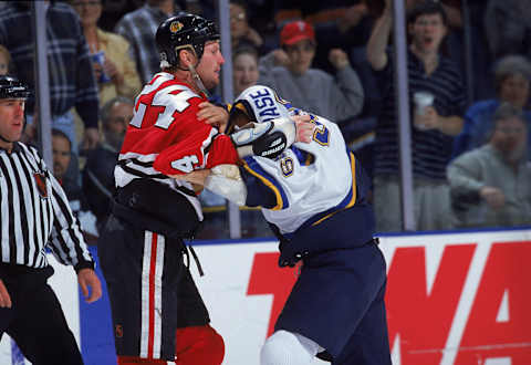 7 Apr 2000: Bob Probert #24 of the Chicago Blackhawks fights with Kelly Chase #39 of the St. Louis Blues at the Kiel Center in St. Louis, Missouri. The Blackhawks defeated the Blues 4-3 in overtime. Mandatory Credit: Elsa Hasch /Allsport