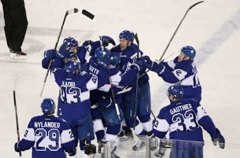 Jan 1, 2017; Toronto, Ontario, CAN; Toronto Maple Leafs center Auston Matthews (34) is congratulated by teammates after scoring the game-winning goal in overtime against the Detroit Red Wings during the Centennial Classic ice hockey game at BMO Field. The Maple Leafs beat the Red Wings 5-4 in overtime. Mandatory Credit: Tom Szczerbowski-USA TODAY Sports