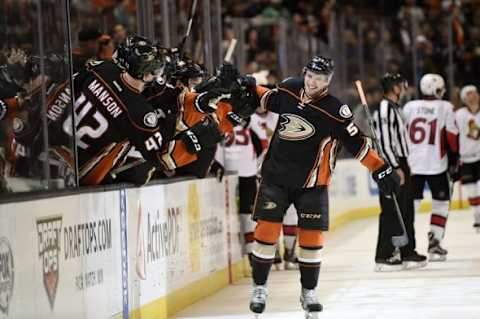 Jan 13, 2016; Anaheim, CA, USA; Anaheim Ducks defenseman Shea Theodore celebrates with his team after scoring his first NHL goal during the third period against the Ottawa Senators at Honda Center. The Anaheim Ducks won 4-1. Mandatory Credit: Kelvin Kuo-USA TODAY Sports