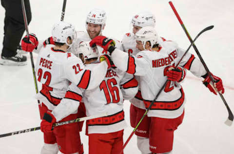 Feb 2, 2021; Chicago, Illinois, USA; Carolina Hurricanes center Vincent Trocheck (16) celebrates with teammates after scoring against the Chicago Blackhawks during the third period at United Center. Mandatory Credit: Kamil Krzaczynski-USA TODAY Sports