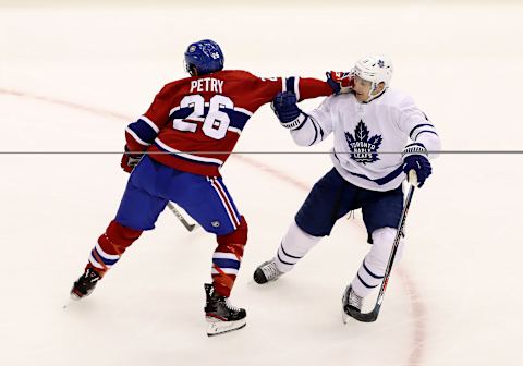 TORONTO, ONTARIO – JULY 28: Jeff Petry #26 of the Montreal Canadiens and Zach Hyman #11 of the Toronto Maple Leafs   (Photo by Andre Ringuette/Freestyle Photo/Getty Images)