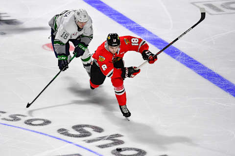 KENT, WASHINGTON – DECEMBER 28: Tyson Kozak #18 of the Portland Winterhawks, right, and Andrej Kukuca #18 of the Seattle Thunderbirds chase down the puck during the third period of the match at the accesso ShoWare Center on December 28, 2019 in Kent, Washington. The Portland Winterhawks top the Seattle Thunderbirds 4-1. (Photo by Alika Jenner/Getty Images)