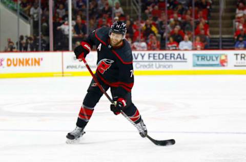 RALEIGH, NORTH CAROLINA – JUNE 01: Jaccob Slavin #74 of the Carolina Hurricanes attempts a shot during the third period in Game Two of the Second Round of the 2021 Stanley Cup Playoffs against the Tampa Bay Lightning at PNC Arena on June 01, 2021, in Raleigh, North Carolina. (Photo by Jared C. Tilton/Getty Images)