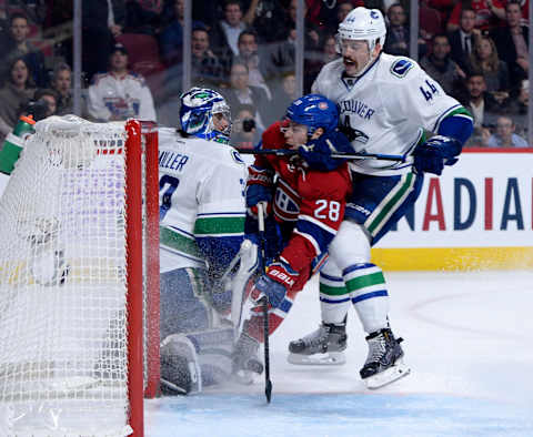 Nov 2, 2016; Montreal, Quebec, CAN; Montreal Canadiens defenseman Nathan Beaulieu (28) scores a goal against Vancouver Canucks goalie Ryan Miller (30) and Erik Gudbranson (44) during the second period at the Bell Centre. Mandatory Credit: Eric Bolte-USA TODAY Sports