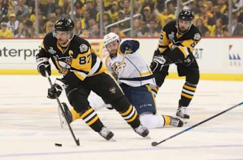 May 31, 2017; Pittsburgh, PA, USA; Pittsburgh Penguins center Sidney Crosby (87) carries the puck past Nashville Predators center Filip Forsberg (9) during the first period in game two of the 2017 Stanley Cup Final at PPG PAINTS Arena. Mandatory Credit: Charles LeClaire-USA TODAY Sports