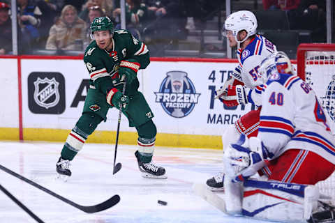 Mar 8, 2022; Saint Paul, Minnesota, USA; Minnesota Wild defenseman Jared Spurgeon (46) shoots the puck against the New York Rangers during the second period at Xcel Energy Center. Mandatory Credit: Harrison Barden-USA TODAY Sports