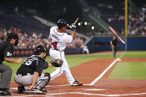 September 28, 2005: Atlanta, Georgia, USA: Julio Franco (14) of the Atlanta Braves breaks a bat on a fly out during the first inning against the Colorado Rockies at Turner Field. Mandatory Credit: Photo By Christopher Gooley-USA TODAY Sports Copyright (c) 2005 Christopher Gooley