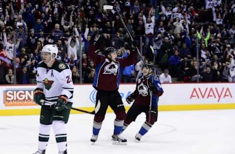 Dec 7, 2015; Denver, CO, USA; Colorado Avalanche center John Mitchell (7) reacts to his overtime winning goal with center Matt Duchene (9) against the Minnesota Wild at Pepsi Center. The Colorado Avalanche defeated the Minnesota Wild 2-1 in overtime. Mandatory Credit: Ron Chenoy-USA TODAY Sports