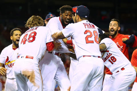 ST. LOUIS, MO – MAY 6: Dexter Fowler #25 of the St. Louis Cardinals is mobbed by his teammates after hitting a walk-off two-run home run in the fourteenth inning at Busch Stadium on May 6, 2018, in St. Louis, Missouri. (Photo by Dilip Vishwanat/Getty Images)