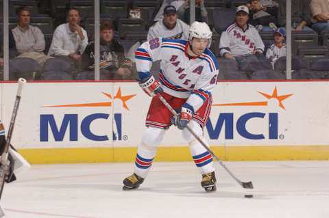 WASHINGTON – OCTOBER 10: Right wing Jaromir Jagr #68 of the New York Rangers passes the puck against the Washington Capitals during the NHL game on October 10, 2005 at MCI Center in Washington D.C. The Capitals defeated the Rangers 3-2. (Photo by Mitchell Layton/Getty Images)