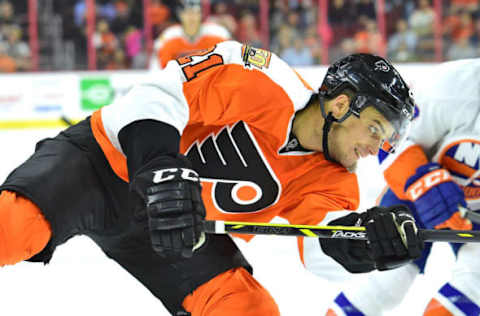 Sep 27, 2016; Philadelphia, PA, USA; Philadelphia Flyers center Scott Laughton (21) against the New York Islanders during a preseason hockey game at Wells Fargo Center. The Flyers defeated the Islanders, 4-0. Mandatory Credit: Eric Hartline-USA TODAY Sports