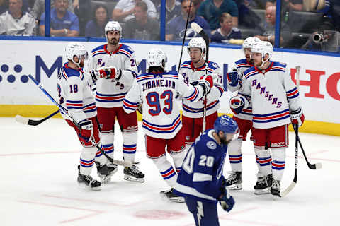 TAMPA, FLORIDA – JUNE 07: Artemi Panarin #10 of the New York Rangers celebrates with his teammates after scoring a goal on Andrei Vasilevskiy #88 of the Tampa Bay Lightning during the third period in Game Four of the Eastern Conference Final of the 2022 Stanley Cup Playoffs at Amalie Arena on June 07, 2022 in Tampa, Florida. (Photo by Mike Carlson/Getty Images)