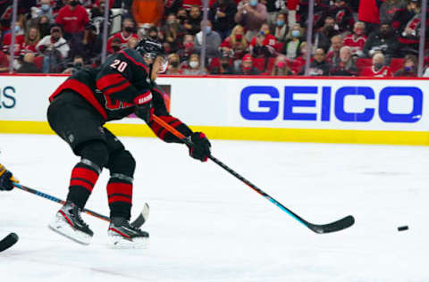 May 17, 2021; Raleigh, North Carolina, USA; Carolina Hurricanes right wing Sebastian Aho (20) takes a shot against the Nashville Predators in game one of the first round of the 2021 Stanley Cup Playoffs at PNC Arena. Mandatory Credit: James Guillory-USA TODAY Sports