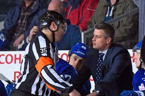 TORONTO, ON – MARCH 26: Head coach Sheldon Keefe of the Toronto Marlies gets an explanation from referee Guillaume Labonte