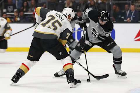 LOS ANGELES, CALIFORNIA – APRIL 06: Derek Forbort #24 of the Los Angeles Kings defends the puck against Ryan Reaves #75 of the Vegas Golden Knights during the first period at Staples Center on April 06, 2019 in Los Angeles, California. (Photo by Yong Teck Lim/Getty Images)