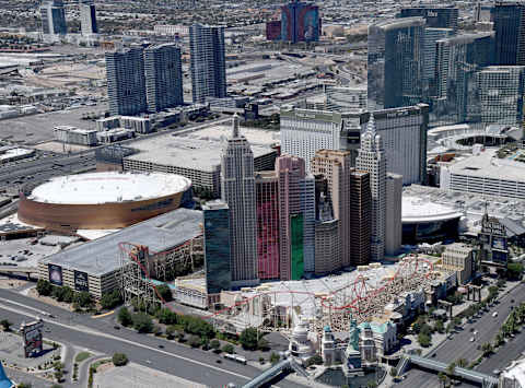 LAS VEGAS, NEVADA – MAY 21: An aerial view shows New York-New York Hotel & Casino (R) and T-Mobile Arena, home of the NHL’s Vegas Golden Knights, both of which have been closed since March 17 in response to the coronavirus pandemic on May 21, 2020 in Las Vegas, Nevada. It is still unclear when casinos in the state will be allowed to reopen or if the NHL will be able to finish the season that was paused as a result of COVID-19. (Photo by Ethan Miller/Getty Images)