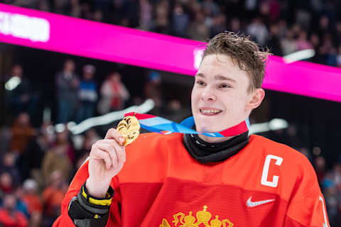 LAUSANNE, SWITZERLAND – JANUARY 22: #10 Ivan Miroshnichenko of Russian Federation shows his goal medal after Men’s 6-Team Tournament Gold Medal Game between Russia and United States of the Lausanne 2020 Winter Youth Olympics on January 22, 2021 in Lausanne, Switzerland. (Photo by RvS.Media/Basile Barbey/Getty Images)