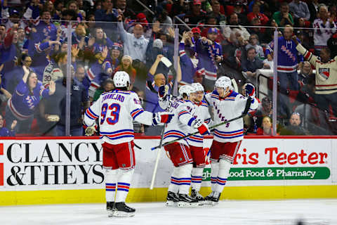 RALEIGH, NC – MARCH 23: Mika Zibanejad #93, Vladimir Tarasenko #91, Adam Fox #23, and Niko Mikkola #77 of the New York Rangers celebrate a goal during the third period of the game against the Carolina Hurricanes at PNC Arena on March 23, 2023, in Raleigh, North Carolina. (Photo by Jaylynn Nash/Getty Images)