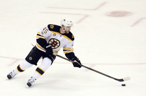 Jan 22, 2017; Pittsburgh, PA, USA; Boston Bruins defenseman Joe Morrow (45) skates with the puck against the Pittsburgh Penguins during the second period at the PPG PAINTS Arena. The Penguins won 5-1. Mandatory Credit: Charles LeClaire-USA TODAY Sports