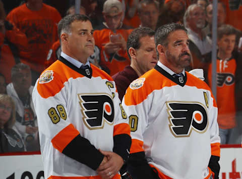 Eric Lindros and John Leclair take part in a pregame ceremony (Photo by Bruce Bennett/Getty Images)