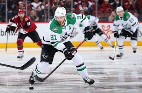 GLENDALE, ARIZONA – DECEMBER 29: Tyler Seguin #91 of the Dallas Stars skates with the puck during the third period of the NHL game against the Arizona Coyotes at Gila River Arena on December 29, 2019 in Glendale, Arizona. The Stars defeated the Coyotes 4-2. (Photo by Christian Petersen/Getty Images)