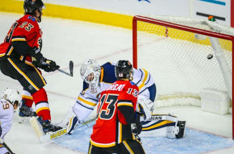 Oct 18, 2016; Calgary, Alberta, CAN; Buffalo Sabres goalie Robin Lehner (40) reacts as Calgary Flames center Sean Monahan (23) scores a goal during the overtime period at Scotiabank Saddledome. Calgary Flames won 4-3. Mandatory Credit: Sergei Belski-USA TODAY Sports