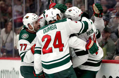 DENVER, COLORADO – DECEMBER 27: Victor Rask #49 of the Minnesota Wild is congratulated by Brad Hunt #77 and Matt Dumba #24 after scoring the go-ahead goal against the Colorado Avalanche in the third period at the Pepsi Center on December 27, 2019, in Denver, Colorado. (Photo by Matthew Stockman/Getty Images)