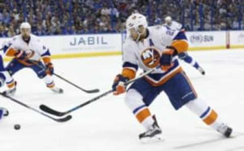 Apr 30, 2016; Tampa, FL, USA; New York Islanders right wing Kyle Okposo (21) passes the puck against the Tampa Bay Lightning during the second period of game two of the second round of the 2016 Stanley Cup Playoffs at Amalie Arena. Mandatory Credit: Kim Klement-USA TODAY Sports