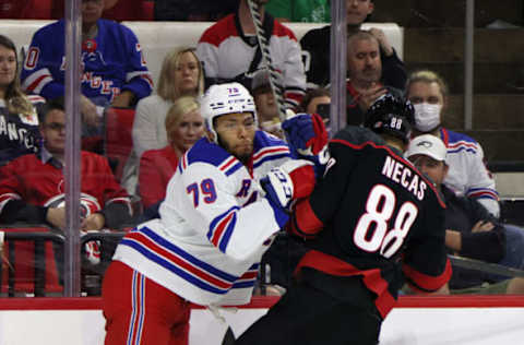 RALEIGH, NORTH CAROLINA – MAY 26: K’Andre Miller #79 of the New York Rangers checks Martin Necas #88 of the Carolina Hurricanes in Game Five of the Second Round of the 2022 Stanley Cup Playoffs at PNC Arena on May 26, 2022, in Raleigh, North Carolina. (Photo by Bruce Bennett/Getty Images)