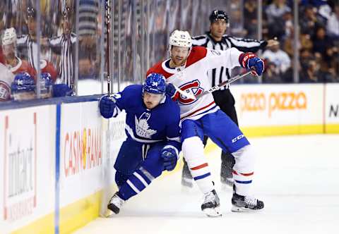 TORONTO, ON – OCTOBER 05: Jeff Petry #26 of the Montreal Canadiens checks Auston Matthews #34 of the Toronto Maple Leafs into the boards during an NHL game at Scotiabank Arena on October 5, 2019 in Toronto, Canada. (Photo by Vaughn Ridley/Getty Images)