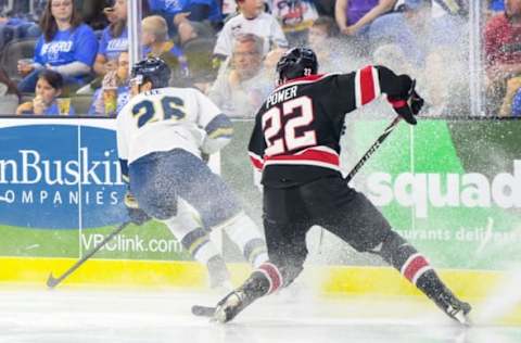 Chicago Steel defenseman Owen Power kicks up ice behind Sioux Falls Stampede forward Andre Lee in game one of the Clark Cup finals on Friday, May 10, at the Sanford Premier Center in Sioux Falls.Stampede Game One 007